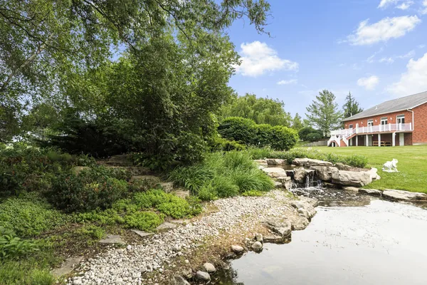 A rock waterfall feeding the water garden